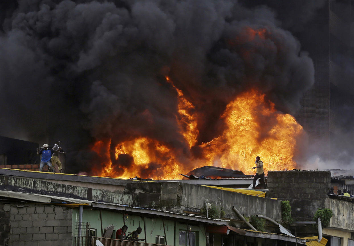 Smoke rises from a fire in downtown Lagos, Nigeria, Tuesday, Nov. 5, 2019. (Photo: Sunday Alamba/AP)