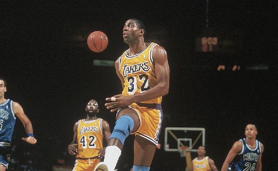 Magic Johnson makes a no-look pass.