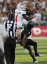 Western Kentucky wide receiver Michael Mathison (4) makes a catch over Hawaii defensive back Malik Hausman (9) during the first half of an NCAA college football game Saturday, Sept. 3, 2022, in Honolulu. (AP Photo/Marco Garcia)