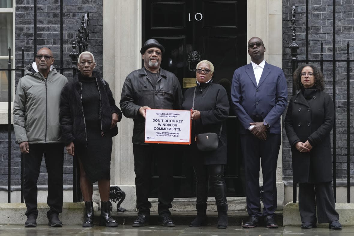 From left, Windrush campaigners Michael Anthony Braithwaite, Janet Mckay-Williams, Auckland Elwaldo Romeo, Glenda Caesar, Patrick Vernon and Dr Wanda Wyporska pose for photograph as they hand in a letter to Downing Street, in London, Thursday April, 6, 2023. (AP Photo/Kin Cheung)