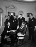 President John F. Kennedy meets with Carlos Martínez Sotomayor, Foreign Minister of Chile. Carlos Martínez Sotomayor (seated on couch); President Kennedy (in rocking chair); Walter Müller, Ambassador of Chile (at back); others unidentified. Oval Office, White House, Washington, D.C. (JFK Presidential Library)