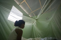 <p>Alicia sits on her bed at her home in Las Matas de Farfan, Dominican Republic on June 12, 2009. (© Tatiana Fernandez) </p>