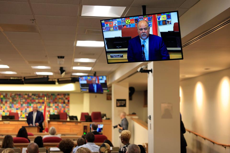 Christopher Bernier, pictured, speaks to a group during a ceremony where he was sworn in in July.