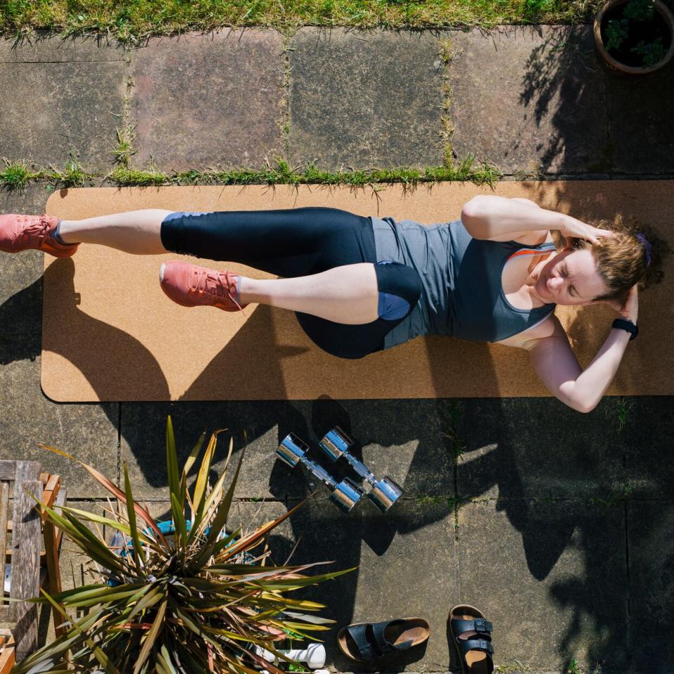 woman exercising on a mat