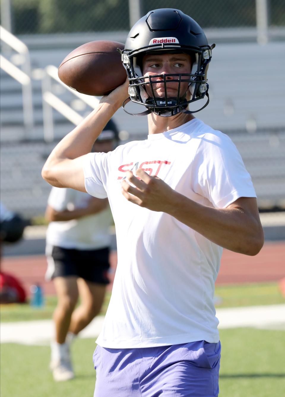 Quarterback A.J. Miller in action as football players run drills on the first day of Varsity and Junior Varsity football practice at Rye High School, Aug. 20, 2022.