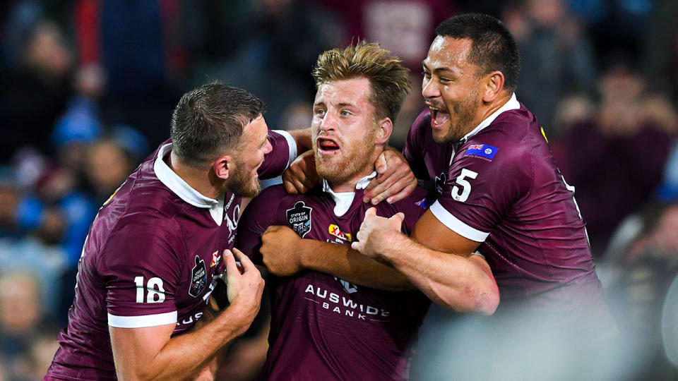 Seen here, Cameron Munster celebrates a try for the Maroons in Origin Game I.