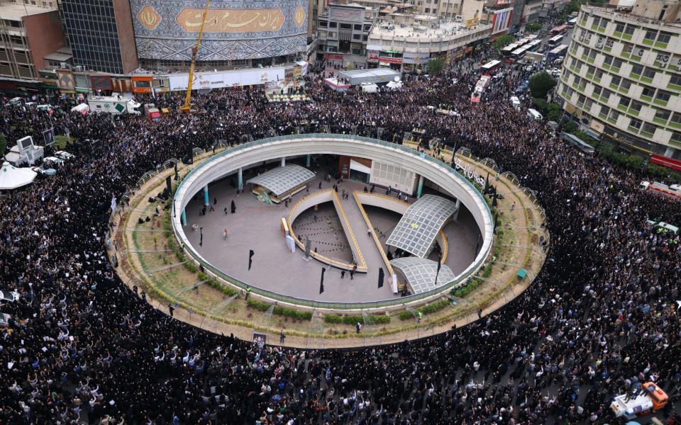 Iranians gather at Valiasr Square in central Tehran to mourn the deaths of President Ebrahim Raisi and Foreign Minister Hossein Amir-Abdollahian.