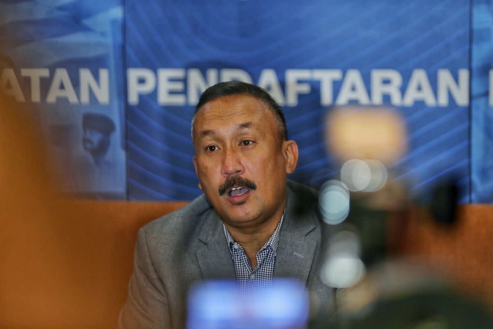 National Registration Department (NRD) director-general Datuk Ruslin Jusoh speaks to reporters during a press conference at NRD headquaters in Putrajaya September 9, 2019. — Picture by Ahmad Zamzahuri