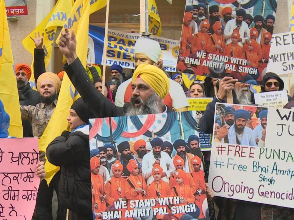 Hundreds of people in Vancouver rallied at the Consulate General of India on Howe Street to speak out against the Indian government's activities to find and arrest Amritpal Singh in the state of Punjab. (Janella Hamilton/CBC News - image credit)