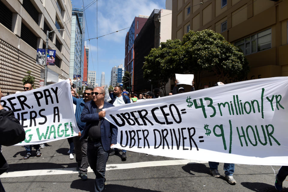 Protestors march through the financial district, demanding fair wages and more transparency during a strike against Uber in San Francisco, California, U.S., May 8, 2019.   REUTERS/Kate Munsch