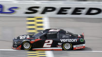 Brad Keselowski crosses the start/finish line as he heads down a straightaway during a NASCAR Cup Series auto race at Kansas Speedway in Kansas City, Kan., Sunday, May 2, 2021. (AP Photo/Colin E. Braley)