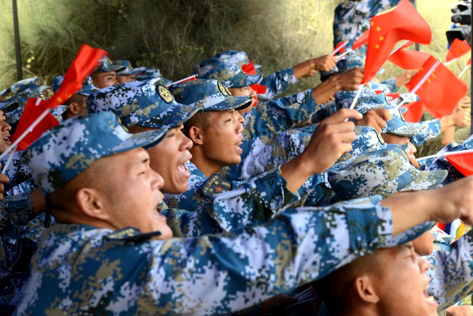 <p>Chinese soldiers cheer in the survival trail event of the International Army Games 2018 ‘Seaborne Assault’ on Aug. 2, 2018 in Quanzhou, Fujian Province of China. (Photo: Wang Dongming/China News Service/VCG via Getty Images) </p>