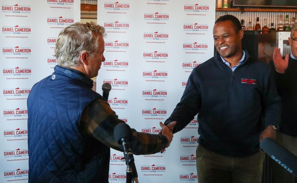 Senator Rand Paul greets Attorney General Daniel Cameron speaks to supporters during a campaign stop in Jeffersontown on Friday, October 20, 2023