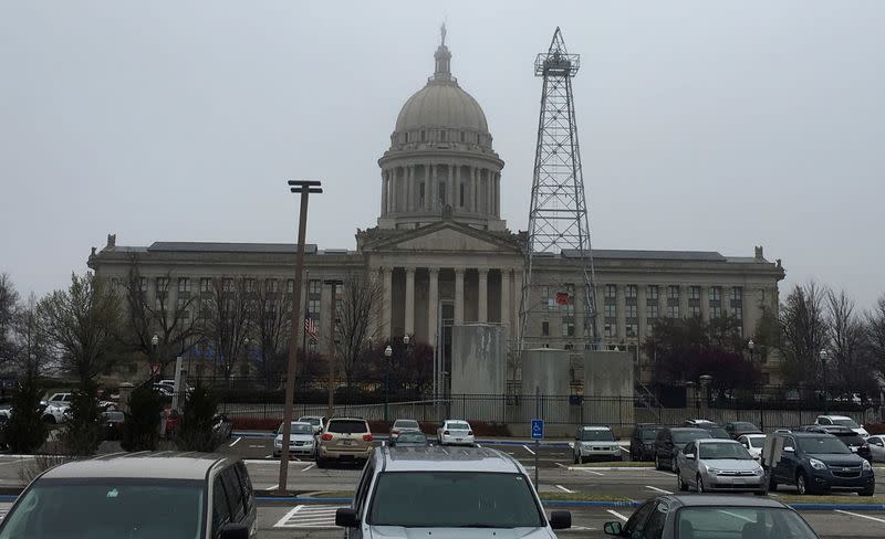 FILE PHOTO: An oil drilling rig is seen near a parking lot in front of the state capitol building in Oklahoma City