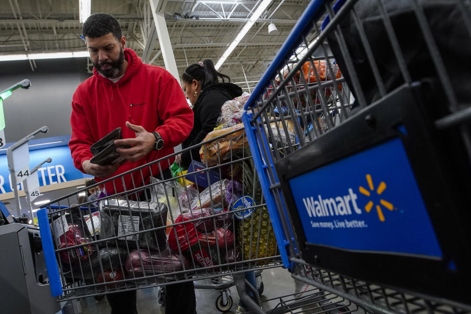 Francisco Santana shops at the Walmart Supercenter in North Bergen, N.J., on Thursday, Feb. 9, 2023. The inflation surge led Santana, a New York City resident, to shift his grocery shopping from local chains to Walmart. (AP Photo/Eduardo Munoz Alvarez)