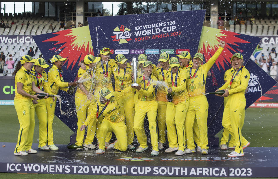 Australia players celebrate after winning the Women's T20 World Cup semi final cricket match against South Africa, in Cape Town, South Africa, Sunday Feb. 26, 2023. (AP Photo/Halden Krog)