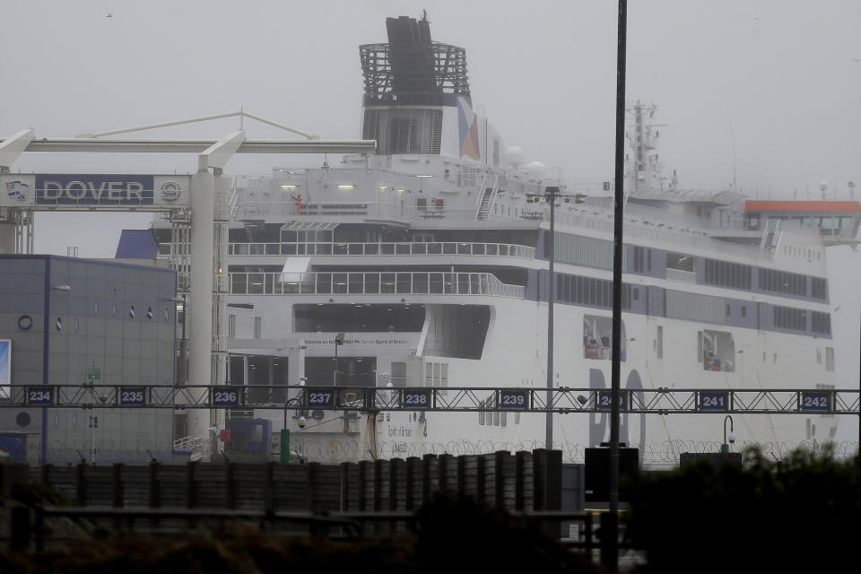 A passenger ferry waits at the closed ferry terminal in Dover, England, Monday, Dec. 21, 2020, after the Port of Dover was closed and access to the Eurotunnel terminal suspended following the French government's announcement. France banned all travel from the UK for 48 hours from midnight Sunday, including trucks carrying freight through the tunnel under the English Channel or from the port of Dover on England's south coast. (AP Photo/Kirsty Wigglesworth)