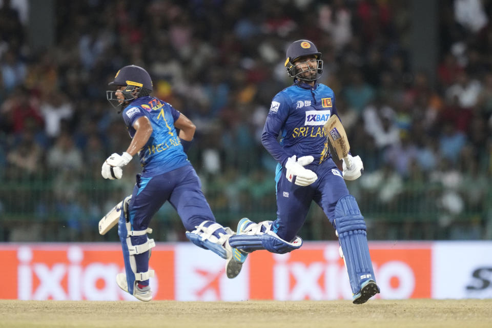 Sri Lanka's Dhananjaya de Silva, right, and Dunith Wellalage run between wickets during the Asia Cup cricket match between Sri Lanka and India in Colombo, Sri Lanka, Tuesday, Sept. 12, 2023. (AP Photo/Eranga Jayawardena)