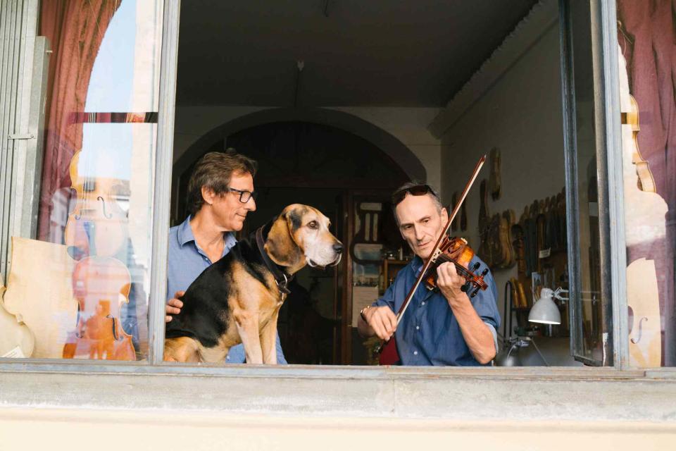 <p>Federico Ciamei</p> Violin maker Gaspar Borchardt, left, at his Cremona studio, with musician Fabio Imbergamo.