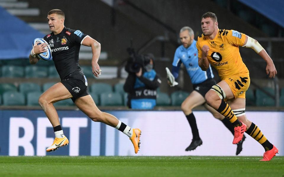 Henry Slade races away for his team's first try - GETTY IMAGES