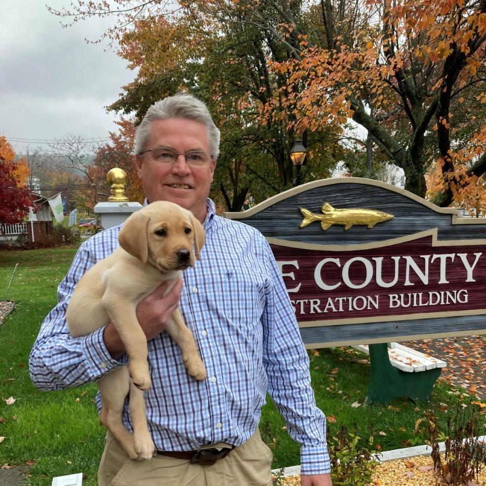 Pike County Treasurer John Gilpin and his new puppy Maine.