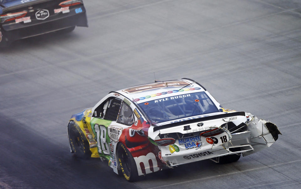 Kyle Busch make his way around the track after being involved in a crash during the NASCAR Cup Series auto race Saturday, Aug. 18, 2018, in Bristol, Tenn. (AP Photo/Wade Payne)