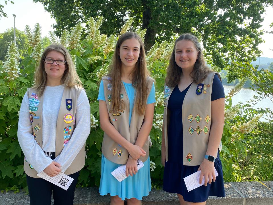 From left, Girl Scout Troop 20094 members Ashlyn Wilkerson, Annsley Bruce and Ella Wolfe present to a church group about PJ Parkinson’s support group in May 2022.