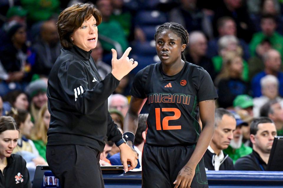 Jan 14, 2024; South Bend, Indiana, USA; Miami Hurricanes head coach Katie Meier talks to her players in the first half against the Notre Dame Fighting Irish at the Purcell Pavilion. Mandatory Credit: Matt Cashore-USA TODAY Sports