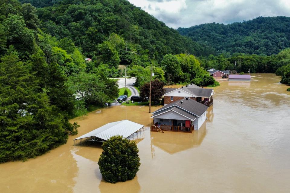 Extreme storms in mountainous regions like eastern Kentucky can quickly funnel floodwater into valleys, creating different hazards than flatter cities would face from the same storm. <a href="https://www.gettyimages.com/detail/news-photo/homes-along-gross-loop-off-of-ky-15-are-flooded-with-water-news-photo/1242172582" rel="nofollow noopener" target="_blank" data-ylk="slk:Arden S. Barnes/For The Washington Post via Getty Images;elm:context_link;itc:0;sec:content-canvas" class="link ">Arden S. Barnes/For The Washington Post via Getty Images</a>