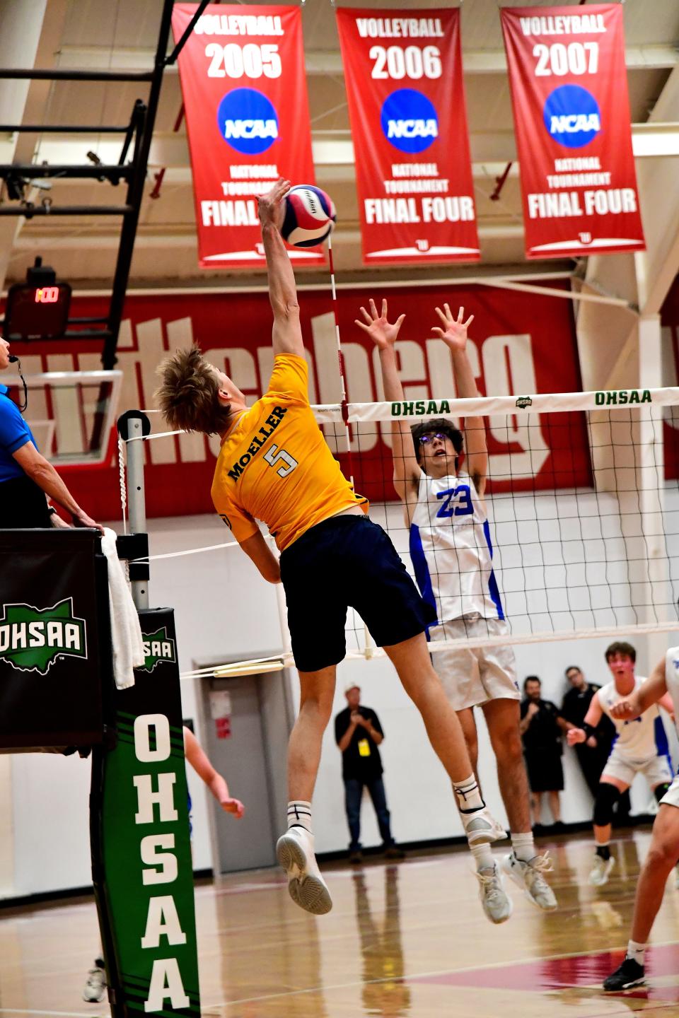 Brody Threm (5) keeps the volley going on what would be the final point scored by Moeller as they capture the state crown at the Inaugural OHSAA Division I Boys Volleyball State Championship, May 28, 2023.