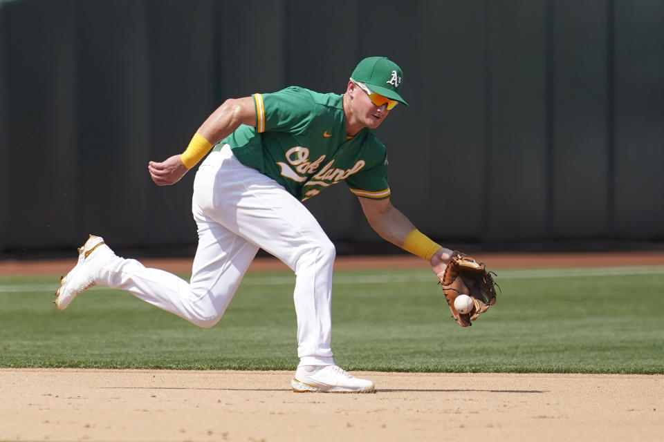 Oakland Athletics third baseman Matt Chapman fields a groundout hit by New York Yankees' Gary Sanchez during the fifth inning of a baseball game in Oakland, Calif., Saturday, Aug. 28, 2021. (AP Photo/Jeff Chiu)