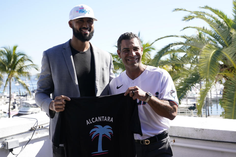 Miami Marlins pitcher Sandy Alcantara, left, the 2022 National League Cy Young winner, poses with Miami Mayor Francis Suarez, right, after being awarded the key to the City of Miami by the mayor at Miami City Hall, Tuesday, Jan. 10, 2023, in Miami. (AP Photo/Lynne Sladky)