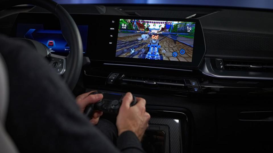 bmw video game with controller in car