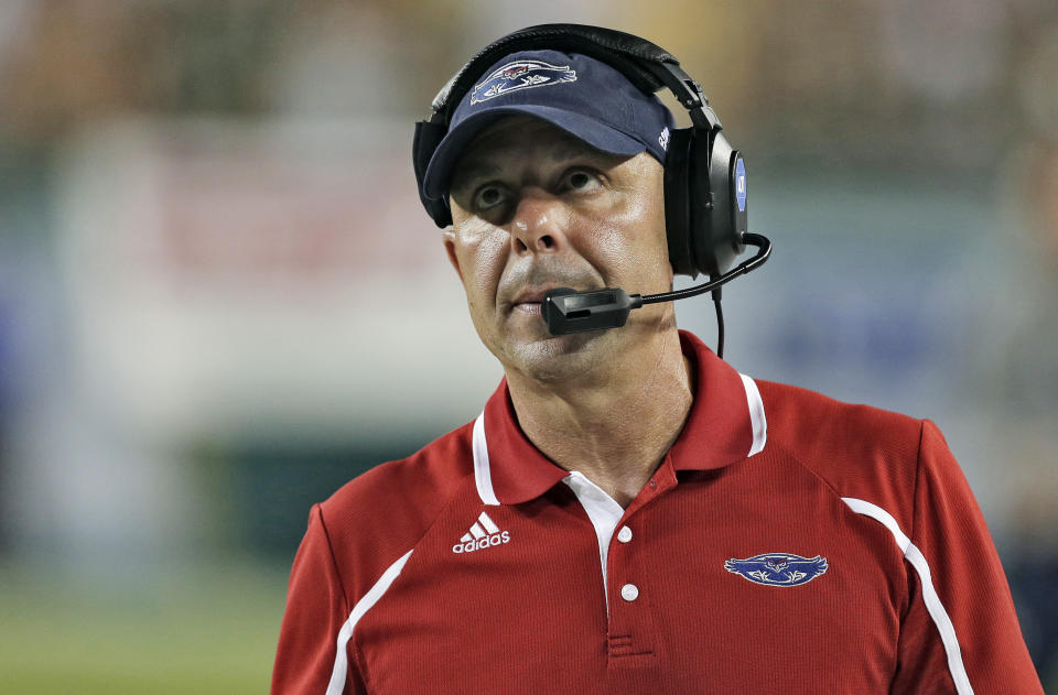 FILE- In this Sept. 14, 2013, file photo, Florida Atlantic head coach Carl Pelini watches during the fourth quarter of an NCAA college football game against South Florida in Tampa, Fla. Pelini said Friday, April 18, 2014 during a radio interview that his firing at Florida Atlantic last year was unjustified and the result of a new athletic director who wanted to hire his own football coach. (AP Photo/Chris O'Meara, File)