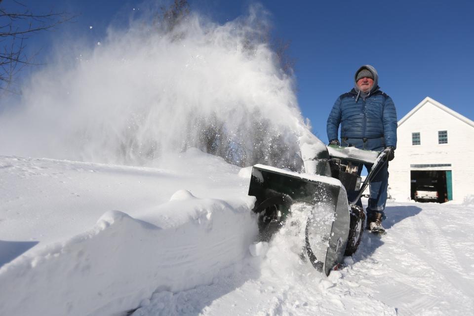 Dennis Duffy of Dover clears snow Sunday, Jan. 30, 2022 following the blizzard the previous day.