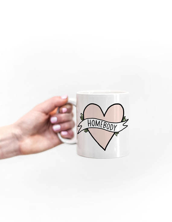 <a href="https://www.etsy.com/listing/520416919/homebody-mug-11-ounce-coffee-mug-funny?ga_order=most_relevant&amp;ga_search_type=all&amp;ga_view_type=gallery&amp;ga_search_query=homebody%20gifts&amp;ref=sr_gallery_1" target="_blank">Shop it here</a>.