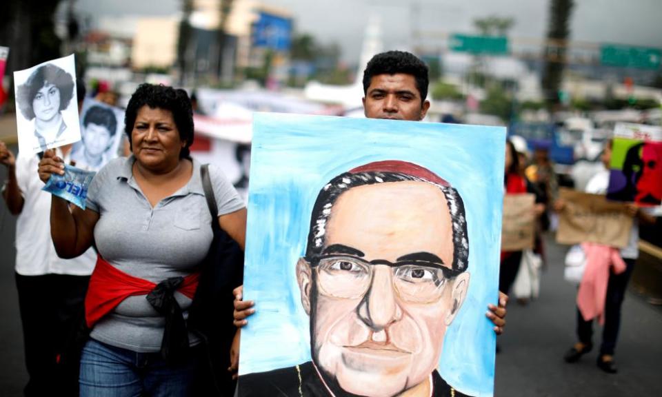 People carry a portrait of the Óscar Romero during a demonstration to ask to reopen the case of his murder. Romero will be declared saint by the Catholic church on 14 October.