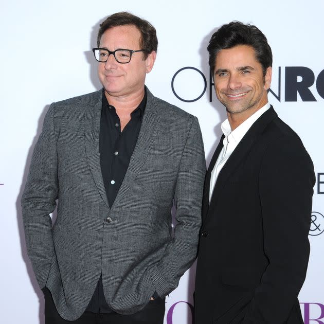 Happier times: Bob Saget and John Stamos arrive at the Los Angeles premiere of 