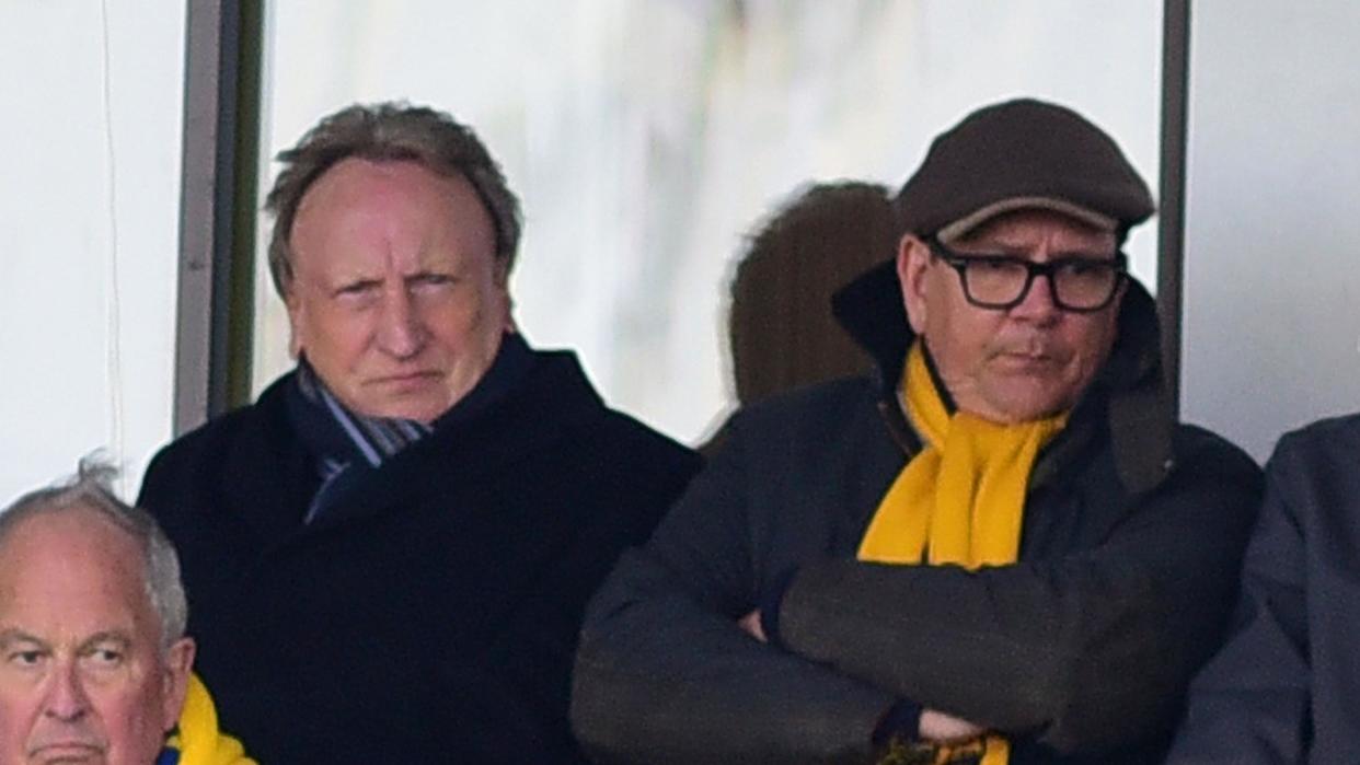 Michael Westcott (right) sits next to experienced former Torquay United manager Neil Warnock at a game at Plainmoor 