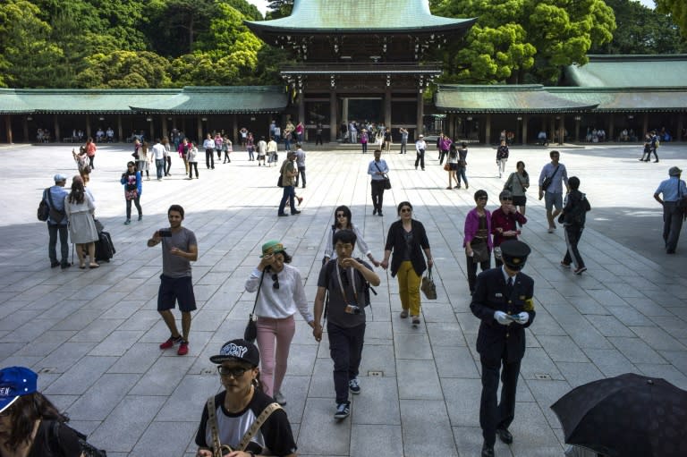 People visit the Meiji-jingu temple in Tokyo on May 14, 2015, dedicated to Emperor Meiji