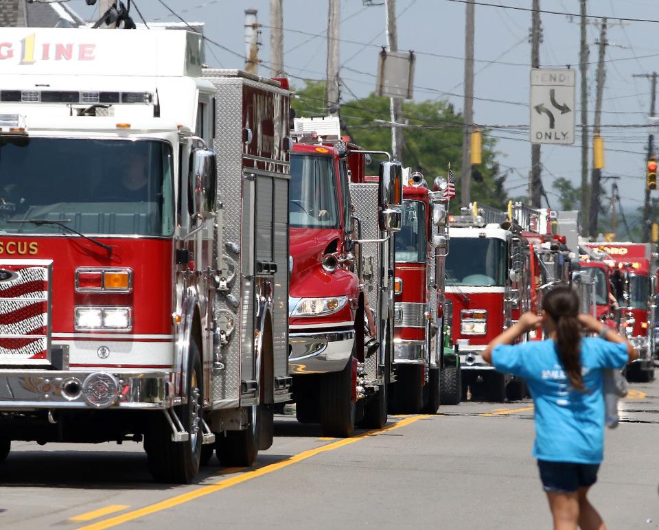 Fire engines from across the Alliance area head south Sunday, Aug. 7, 2022, on Union Avenue in Alliance during the Greater Alliance Carnation Festival Kick Off Parade.