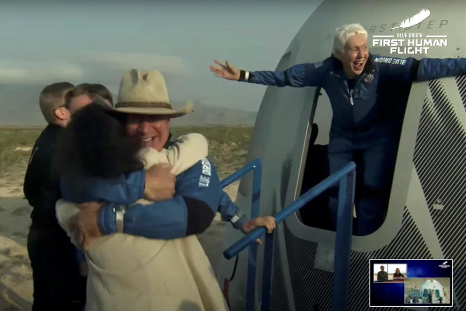 Jeff Bezos and Wally Funk emerge from their capsule after their flight aboard Blue Origin's New Shepard rocket near Van Horn, Texas, on Tuesday, July 20, 2021 in a still image from video.  / Credit: BLUE ORIGIN