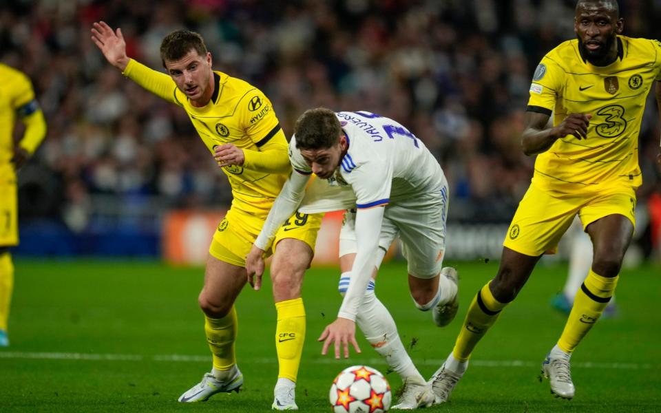 Chelsea's Mason Mount, left, Real Madrid's Federico Valverde, center, and Chelsea's Antonio Rudiger fight for the ball during the Champions League, quarterfinal second leg soccer match between Real Madrid and Chelsea at the Santiago Bernabeu stadium in Madrid, Spain, Tuesday, April 12, 2022. - AP