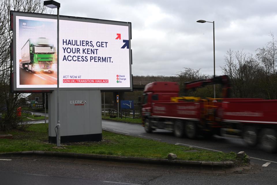 A picture shows an electronic billboard warning hauliers of the new documentation required to travel through Kent for access to the Port of Dover or Eurotunnel since Britain left the EU single market and customs union at a service station off the M25 motorway in Greater London on January 11, 2021. (Photo by DANIEL LEAL-OLIVAS / AFP) (Photo by DANIEL LEAL-OLIVAS/AFP via Getty Images)