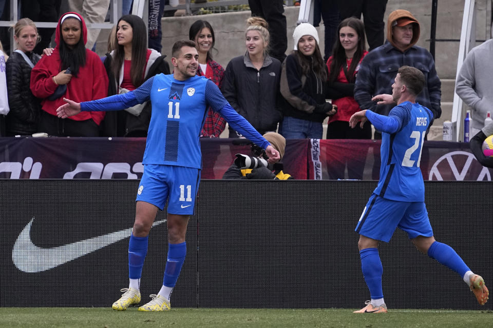 Slovenia forward Nejc Gradisar (11) celebrates his goal with teammate Matija Kavcic (21) during the first half of an international friendly soccer match against the United States in San Antonio, Saturday, Jan. 20, 2024. (AP Photo/Eric Gay)