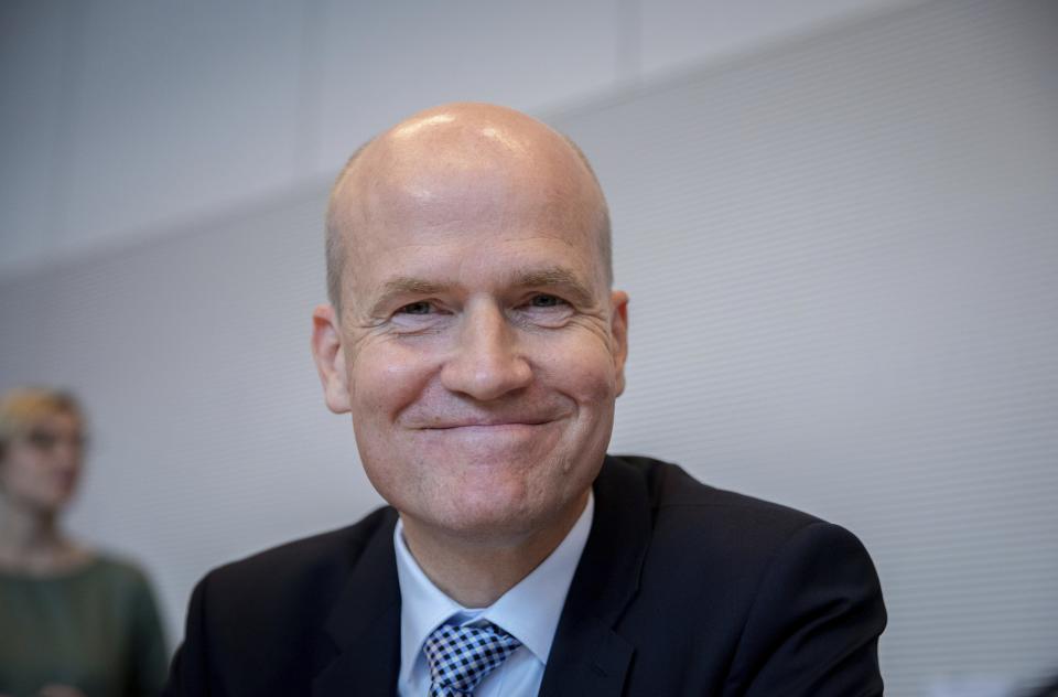 Ralph Brinkhaus, deputy chairman of the joint faction of the Christian Democratic parties smiles before a faction meeting in Berlin Tuesday, Sept. 25, 2018. (Kay Nietfeld/dpa via AP)