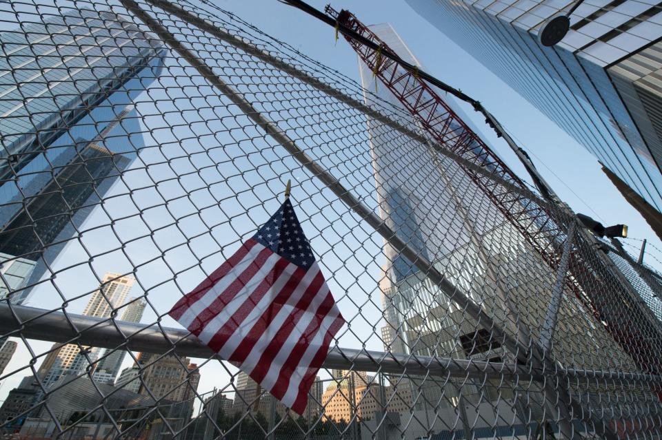 <p>A makeshift memorial lines the fence on the 16th Anniversary of the attacks of September 11 at the World Trade Center 9/11 Memorial on Sept. 11, 2017, in New York. (Photo: Bryan R. Smith/AFP/Getty Images) </p>