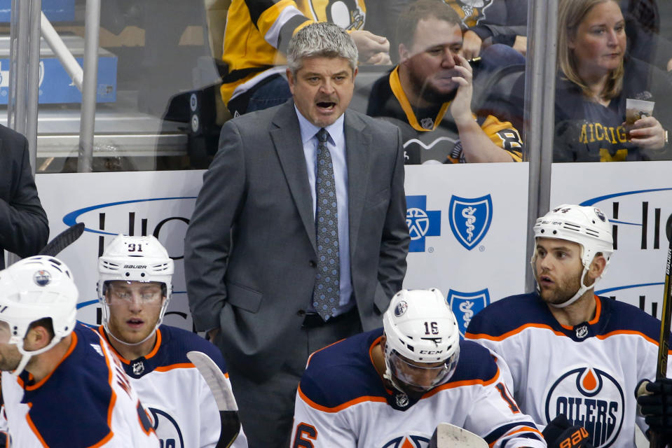 Former Edmonton Oilers head coach Todd McLellan stands behind his bench. (AP Photo/Gene J. Puskar)