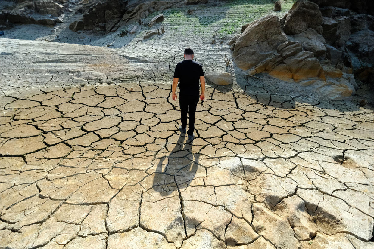 A man is seen walking in the area where the dam water recedes near Caglayan Bridge in Kirklareli, Turkiye on October 04, 2023. Ozgun Tiran/Anadolu via Getty Images