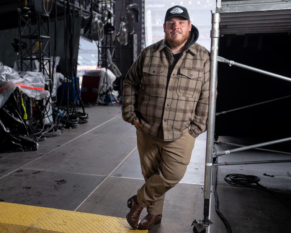 Luke Combs poses for a portrait on the stage at Empower Field at Mile High in Denver, Colo., Friday, May 20, 2022.
